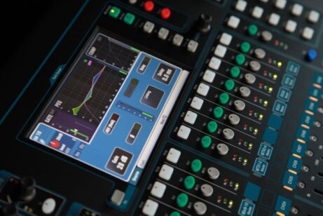 AV technician organizing cables in an equipment rack